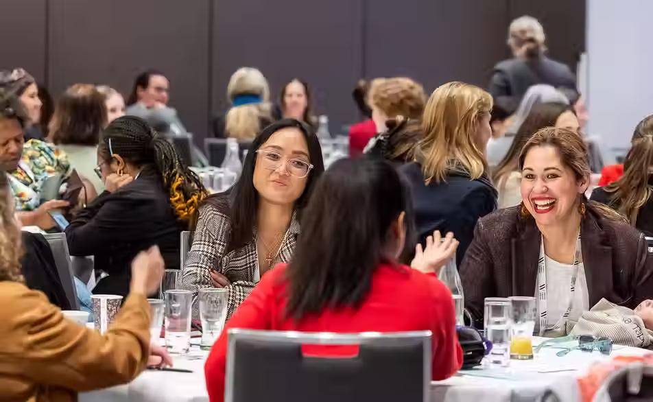 Delegates networking at a conference lunch table